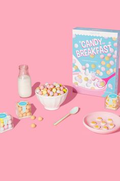 the candy breakfast is ready to be eaten with milk and marshmallows on the table