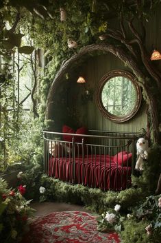 a bed in the middle of a forest with a round window and red bedspread