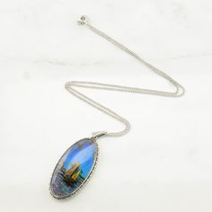 For More Unique Vintage Sterling Silver Necklaces Please visit  https://www.etsy.com/shop/Vintage925Chi?section_id=13899333 Vintage English  Sterling Silver Blue, Iridescent Butterfly Wing Painted Boats Necklace   This necklace weighs 7.3 Grams The stone/design of this necklace is Butterfly Wing Painted Boats Natural The color is Blue, Iridescent This necklace is 18" long  The necklace is 1.4 mm wide Markings: Pat 202213, TLM Sterling, Made in England, (Tested Sterling Silver) Condition: Estate, Iridescent Butterfly, Boat Painting, Butterfly Wing, Stone Design, Butterfly Wings, Silver Blue, Vintage Sterling Silver, Sterling Silver Necklaces, Unique Vintage