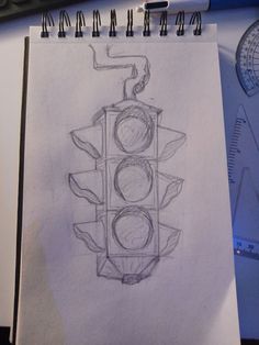 a drawing of a traffic light on paper