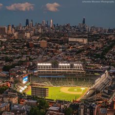 an aerial view of a baseball stadium in the city