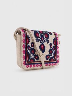 YASMINE SLING BAG – BEIGEHandcrafted Embroidered Sling Bag from India - Stylish and Artfully Designed.Elevate your style with Beige Base Sling Bag featuring intricate Blue Wool Embroidery. This Boho Chic Crossbody Bag combines practicality with a unique Artisan Design. Stand out elegantly with this Floral Embroidered Handbag, perfect for any adventure.- Material: Cotton Canvas (Embroidered)- Dimensions: (H) 6.5“x (W) 10“x (D) 2“- Bag Height including Handle = 29“- Handle Drop = 22.5" (Adjustable Multicolor Embroidered Woven Motifs Shoulder Bag For Everyday Use, Multicolor Embroidered Shoulder Bag For Everyday Use, Traditional Beige Bags With Floral Embroidery, Bohemian Beige Shoulder Bag With Floral Embroidery, Multicolor Embroidered Crossbody Shoulder Bag With Adjustable Strap, Multicolor Embroidered Rectangular Bags With Adjustable Strap, Rectangular Bag With Multicolor Embroidery And Adjustable Strap, Traditional Crossbody Shoulder Bag With Multicolor Embroidery, Rectangular Bags With Multicolor Embroidery And Adjustable Strap