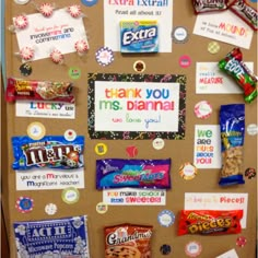 a bulletin board covered in lots of candy