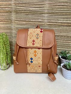 "This Mexican backpack is a perfect accessory for any occasion. Each backpack is a unique piece embroidered with bright colors and a very bohemian style. Each of our pieces is carefully crafted by artisans from the states of Oaxaca and Chiapas. Our items are made of cotton. We ship anywhere in the world, from Tepic, Nayarit, mx. Care instructions: Take care to hand wash your items in cold water and hang them to dry. Measurement in inches width 11\" high 12\" depth 5\"" Bohemian Woven Backpack For Everyday Use, Casual Floral Embroidered Backpack, Casual Floral Embroidery Backpack, Bohemian Woven Backpack For Daily Use, Travel Backpack With Floral Embroidery, Embroidered Shoulder Backpack For Daily Use, Bohemian Backpack For Festivals, Embroidered Rectangular Backpack For Daily Use, Bohemian Brown Backpack Shoulder Bag