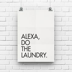 a white poster hanging on the side of a brick wall that says, alexa, do the laundry