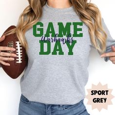 Introducing our "Game Day" sweatshirt, featuring bold block letters and a stylish custom team name in script font overlaying it for a sleek, personalized look. Choose from a variety of color options for both the block and script lettering to match your team spirit perfectly. Crafted from soft, high-quality fabric, this sweatshirt is ideal for cheering on your favorite team in comfort and style. - 50% cotton/50% polyester blend - Loose fit - Medium-heavy fabric - Sewn-in label HOW TO ORDER Please Sporty Mom, Game Day Sweatshirt, Team Sweatshirts, Block Letters, Gifts For Sports Fans, Script Lettering, Team Name, Block Lettering, Color Charts