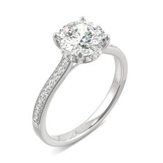 a diamond engagement ring on a white background