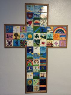 a cross made out of many different pictures