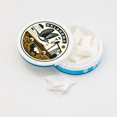 an open container of white sugar sitting on top of a table