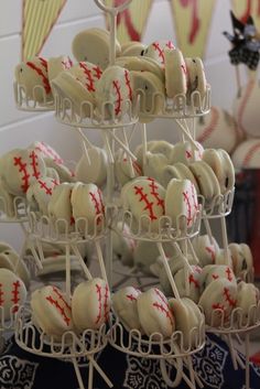 baseball themed desserts are displayed on sticks