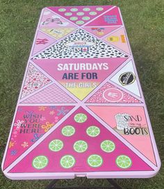 a pink table that has various stickers on it and the words saturday are for the girls