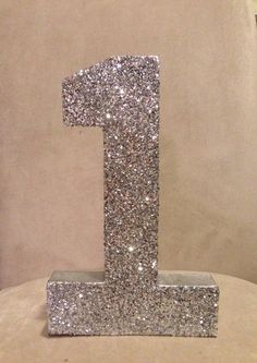 the number one is made out of silver glitter