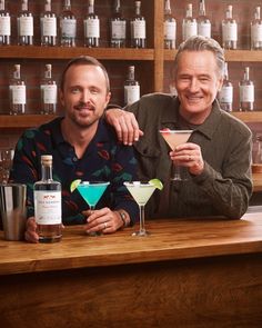 Two men, Bryan Cranston and Aaron Paul, standing at a bar holding Dos Hombres cocktails. A marketing image for a partnership between Bryan Cranston and Aaron Paul's mezcal company, Dos Hombres, and national restaurant brand Applebee's Grill + Bar | Vinnie Finn | Los Angeles Food Photographer Bryan Cranston And Aaron Paul, Aaron Paul, Bryan Cranston, Food Photographer, Marketing Images, Restaurant Branding