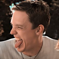 a man making a funny face with his tongue out