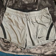 Nike Women’s Dri-Fit Shorts In Grey And Black. Elastic Waistband With Drawstring. Hidden Mesh Inner Back Pocket. Size: M 100% Polyester 16.5” Across 12” Out Seam 5” Inseam Nwt. Nike Gray Athletic Shorts For Athleisure, Nike Gray Athleisure Athletic Shorts, Nike Gray Workout Shorts, Nike Gray Stretch Shorts, Nike Gray Athleisure Shorts, Nike Gray Athletic Shorts, Nike Bottoms With Built-in Shorts In Gray, Nike Gray Bottoms With Built-in Shorts, Gray Go-dry Shorts