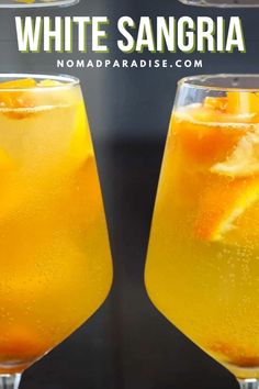 two glasses filled with white sangria next to each other