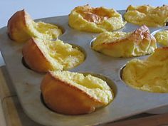 several muffins are sitting on a baking pan and ready to be baked in the oven