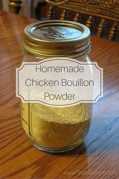 homemade chicken bouilon powder in a glass jar on a wooden table with the words, homemade chicken bouilon powder