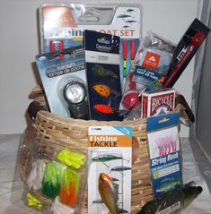 a fishing gift basket filled with lures, books and other things to put in it