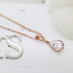 "♥ Earrings ~ For Earrings * Length : 1 \" (Total Length) * Crystal Size : 8 mm * Metal Type : Copper + Rose Gold Plated * Material : Cubic Zirconia ♥ For Necklace * Pendant Length : 7/8 \" (2.2 cm)-Total Length * Crystal Size : 8 mm * Necklace Chain Length : 16\" + Extension 3\" * Metal Type : Copper + Rose Gold Plated * Material : Cubic Zirconia * The parts that we use to make this jewelry are made from Korea. ♥ For Gift box or Organza Bag * All of our items include a gift box or Organza Bag f Rose Gold Teardrop Bridal Necklace Gift, Teardrop Bridal Necklace With Matching Earrings, Teardrop Pendant Bridal Earrings As Gift, Elegant Bridal Earrings With Teardrop Pendant For Gift, Elegant Bridal Earrings With Teardrop Pendant, Elegant Bridal Teardrop Pendant Earrings, Dainty Teardrop Bridal Necklace For Formal Occasions, Copper Rose Gold, Earrings Necklace Set