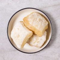 three pieces of bread sitting on top of a white plate