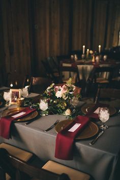 the table is set with place settings for dinner