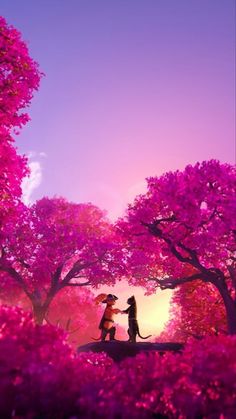 two people standing under an umbrella in the middle of a forest filled with pink flowers