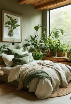 a bedroom with green walls and plants in the window sill, bedding is made up