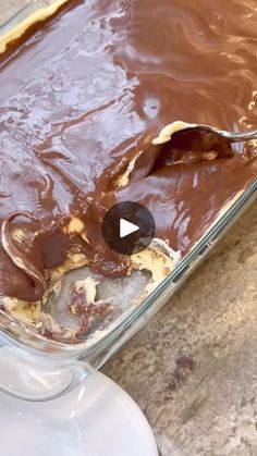 a chocolate dessert in a glass dish with a spoon