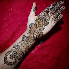 the hand is decorated with intricate designs