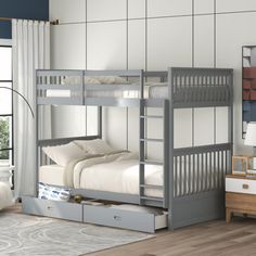 a bunk bed with drawers underneath it in a room next to a dresser and window