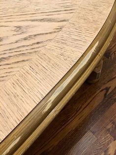 a close up view of a wooden table top with wood grains on the surface