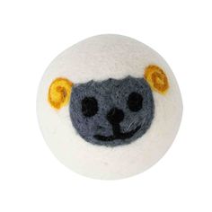 a white ball with a black and yellow sheep face on it's side, sitting in front of a white background