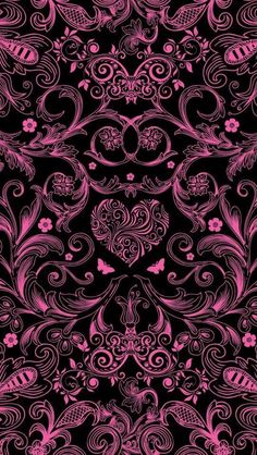 a black background with pink flowers and swirls