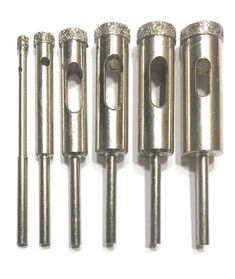 six different sizes of drill heads are shown in this image, including one with the end cut out