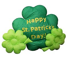 an inflatable st patrick's day balloon with shamrocks around it and the words happy st patrick's day