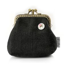 a black purse with a flower on it