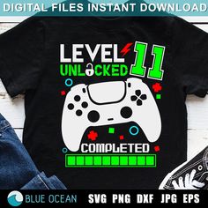 a t - shirt with the words level 1 unlocked and a video game controller on it