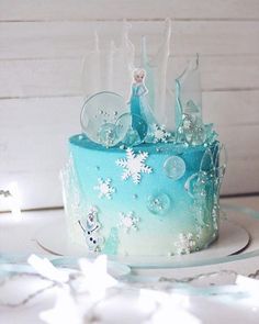 a frozen princess cake with frosting and decorations