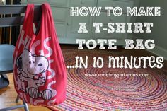 a t - shirt tote bag sitting on top of a rug next to a chair