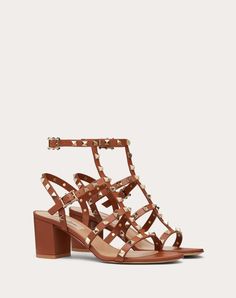 Valentino Garavani Rockstud sandal in calfskin leather. - Platinum-finish studs - Adjustable straps - Heel height 60 mm - Made in Italy Summer Leather Heels With Spikes, Summer Ankle Strap Heels With Studs, Designer Heels With Ankle Strap And Studded Outsoles, Studded Leather Heels For Summer, Leather Heels With Studs For Summer, Summer Leather Heels With Studs, Designer Open Heel Sandals With Studs, Leather High Heel Sandals With Spikes, Formal Ankle Strap Sandals With Studded Rubber Outsoles