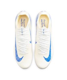 a pair of white and blue nike shoes