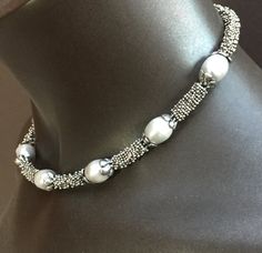 The necklace is 16.5 inches long. It is a classic combination of big white rice pearls and sterling silver beads. It sits comfortably on your neck and would be appropriate for a wedding, dinner out, or the office! It would be a perfect bridesmaid gift or birthday present for a June birthday. Great christmas present for someone special, too. Elegant Oval Beaded Necklaces, Classic Silver Beaded Necklace With Pearl Chain, Elegant Necklace With Silver Oval Beads, Silver Beaded Pearl Necklace For Formal Occasions, Elegant Necklaces With Silver Oval Beads, Elegant Pearl White Necklace With Oval Beads, Elegant Silver Beaded Necklaces With Polished Beads, Elegant Silver Pearl Necklace With Oval Beads, Oval Silver Pearl Necklace