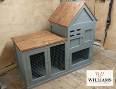 a dog house made out of wood and metal