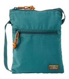 a small blue bag with an orange string hanging from it's front pocket and zippered closure