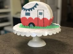 a cake shaped like a trailer is on a table