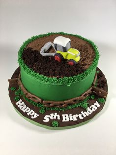 a birthday cake with a tractor on top