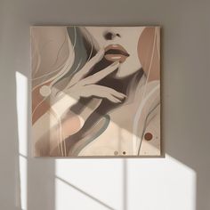 an abstract painting hangs on the wall