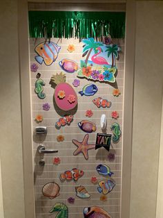 a bathroom door decorated with magnets and decorations