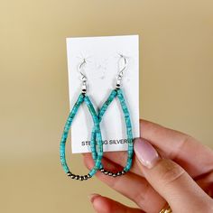 These gorgeous earrings are genuine Native American artwork. They include a long turquoise beaded teardrop with sterling silver Navajo pearls at the center.Earrings measure approximately 2.5inches long. SKU: #0610-2201 Bohemian Sterling Silver Teardrop Beaded Earrings, Southwestern Turquoise Teardrop Beaded Earrings, Southwestern Teardrop Turquoise Beaded Earrings, Southwestern Turquoise Teardrop Earrings, Artisan Turquoise Teardrop Beaded Earrings, Southwestern Teardrop Beaded Earrings, Beaded Teardrop Earrings, Native American Artwork, Navajo Pearls